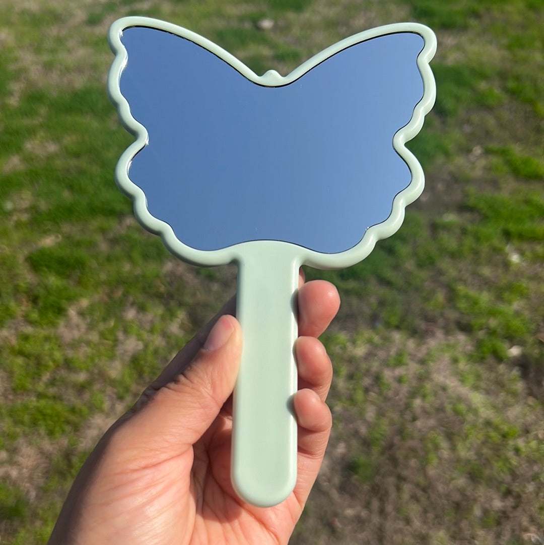 Espejo de mariposa turquesa